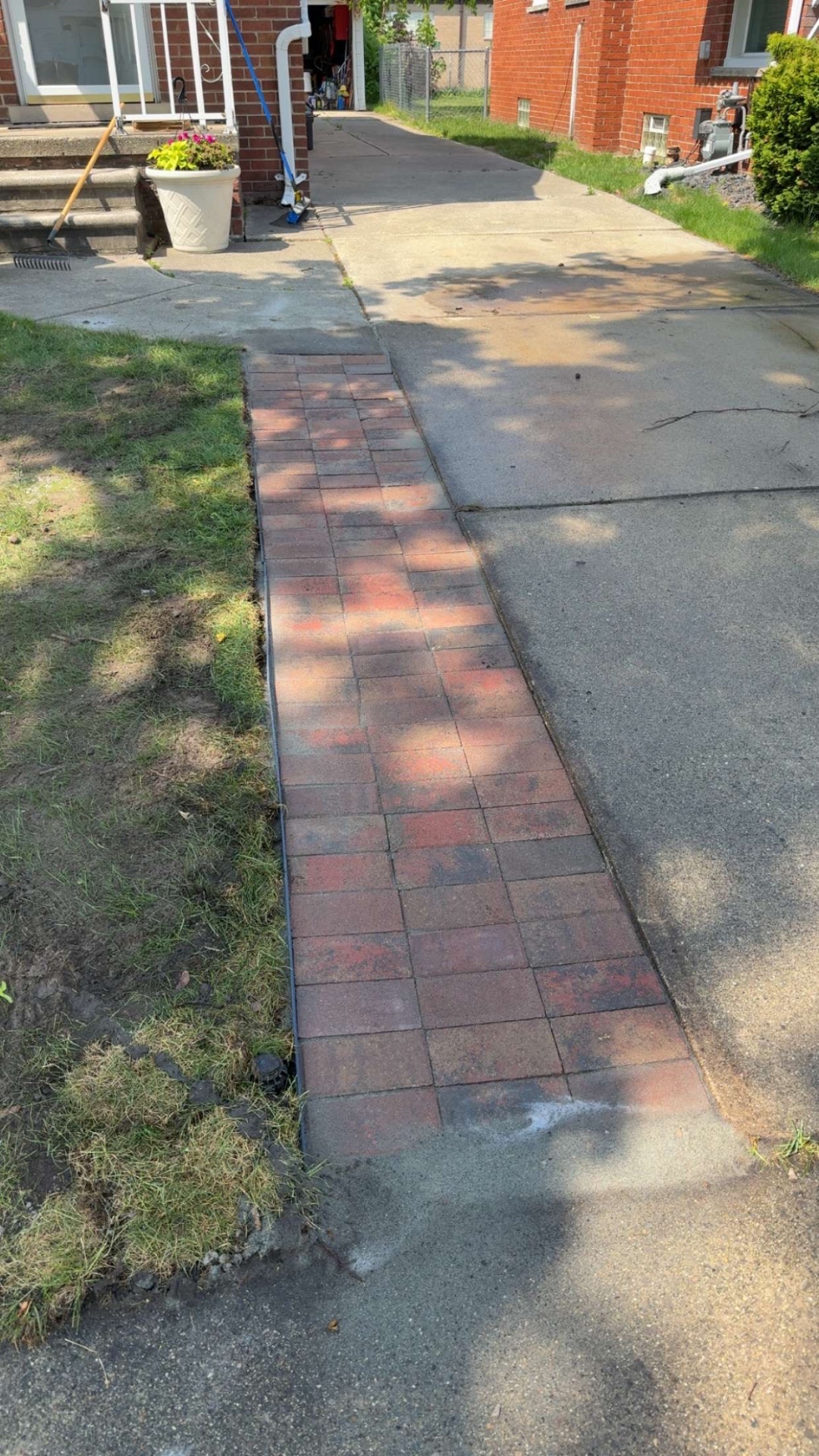 Finished red brick paver walkway